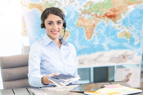 Young,Woman,Travel,Agent,Concept Reisebuero Beratung shutterstock 604880048 scaled 500x0 c default