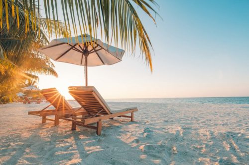 Beautiful,Beach.,Chairs,On,The,Sandy,Beach,Near,The,Sea. shutterstock 633002651 1 scaled 500x0 c default