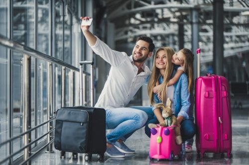 Family,In,Airport.,Attractive,Young,Woman,,Handsome,Man,And,Their