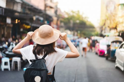Back,View,Of,Asian,Young,Woman,Traveller,At,Street,Market.